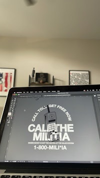 a laptop with a call the millita logo on it