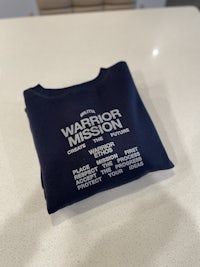 a sweatshirt with the words warrior mission on it