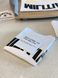 a white t - shirt with the word willie on it