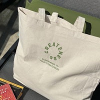 a tote bag with a book and a book on it