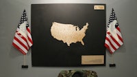 a map of the united states is displayed on a wall