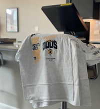 a t - shirt sitting on top of a kitchen counter